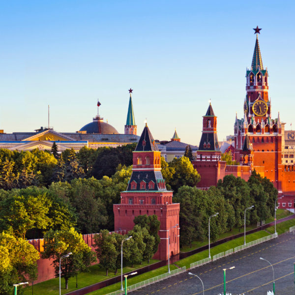 View of the Moscow Kremlin in morning, including The Grand Kremlin Palace and the enclosing Kremlin Wall with Kremlin towers. The complex serves as the official residence of the President of the Russian Federation. View from top of Hotel Baltschug Kempinski.